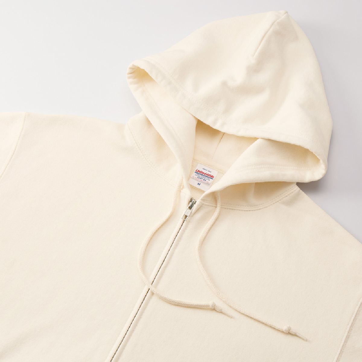 Features a three-dimensional double hood