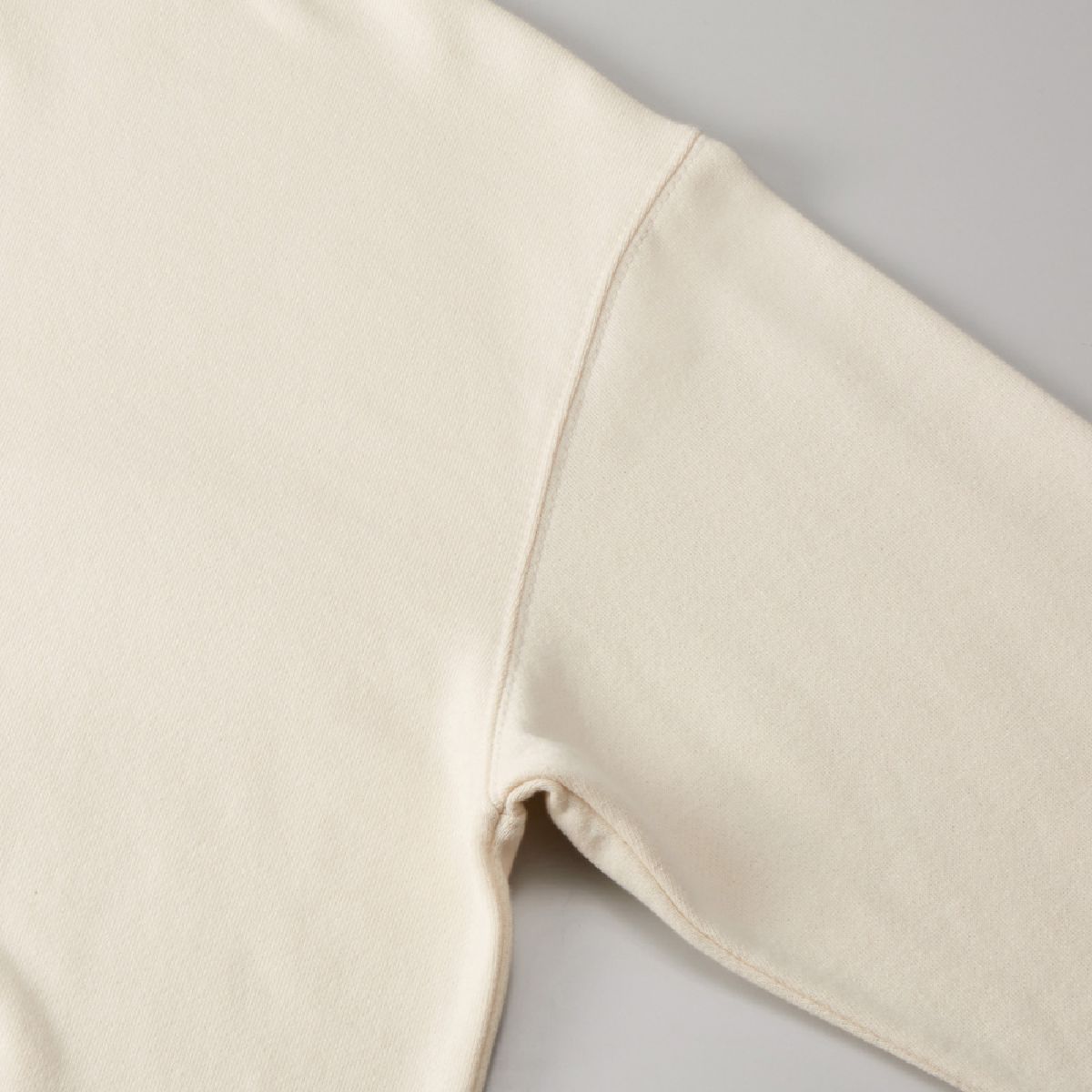 The armholes are sturdy, two-needle needles.