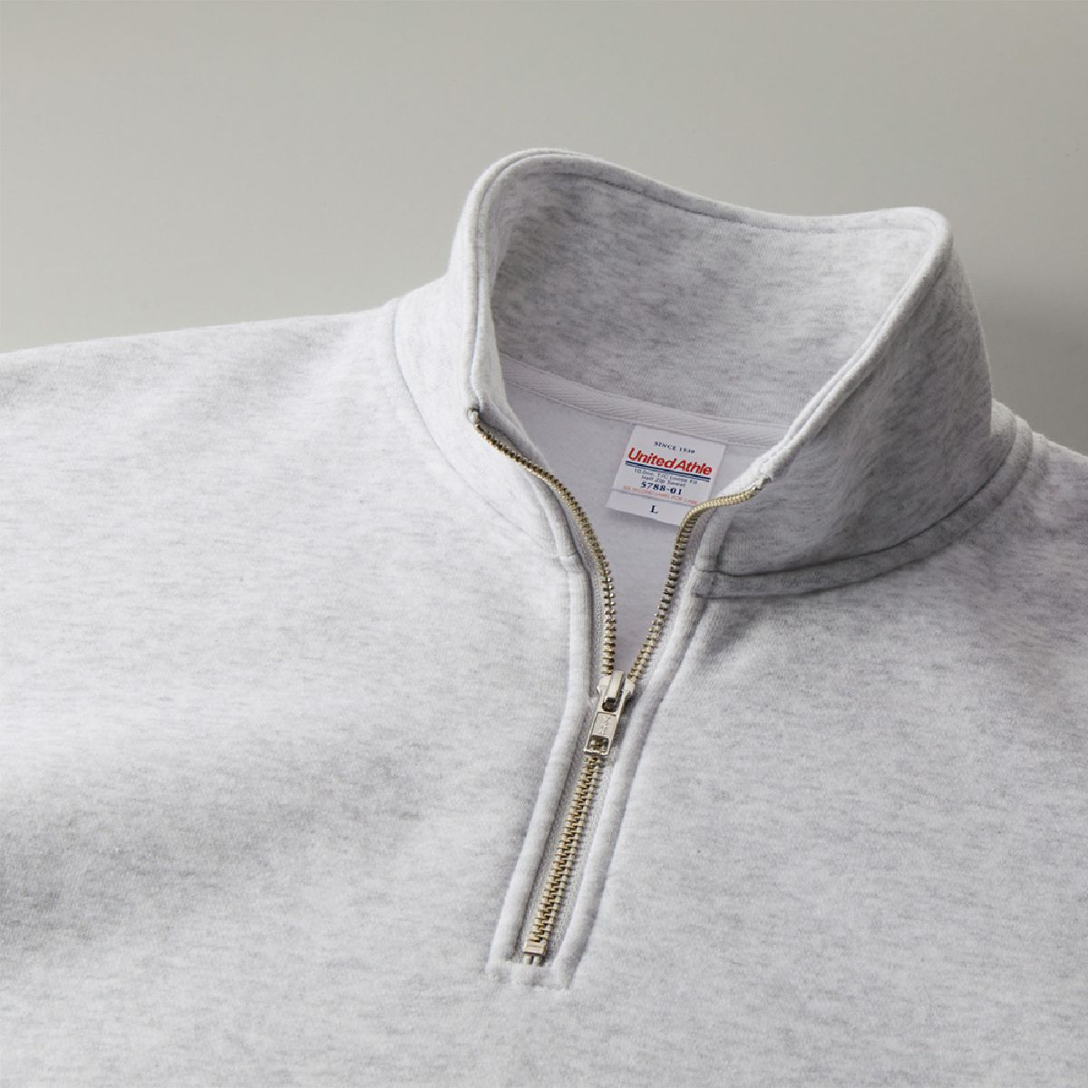 Half zip neck and zipper are made by YKK
