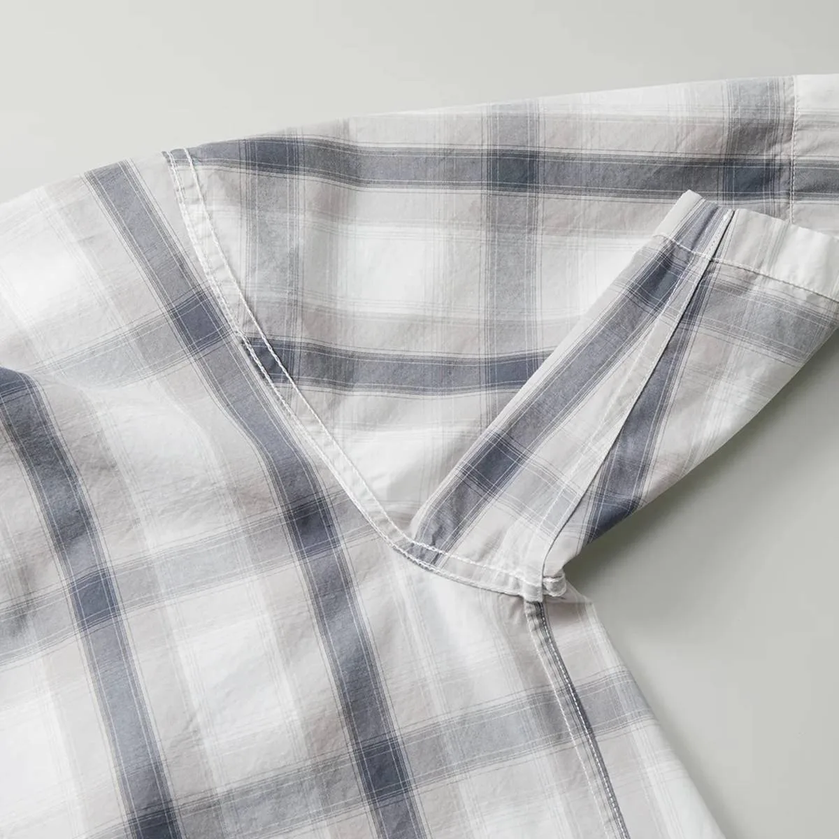 Close-up of the underarm and side seam line when the garment is turned inside out, showing the sturdy flat-felled seam finish.