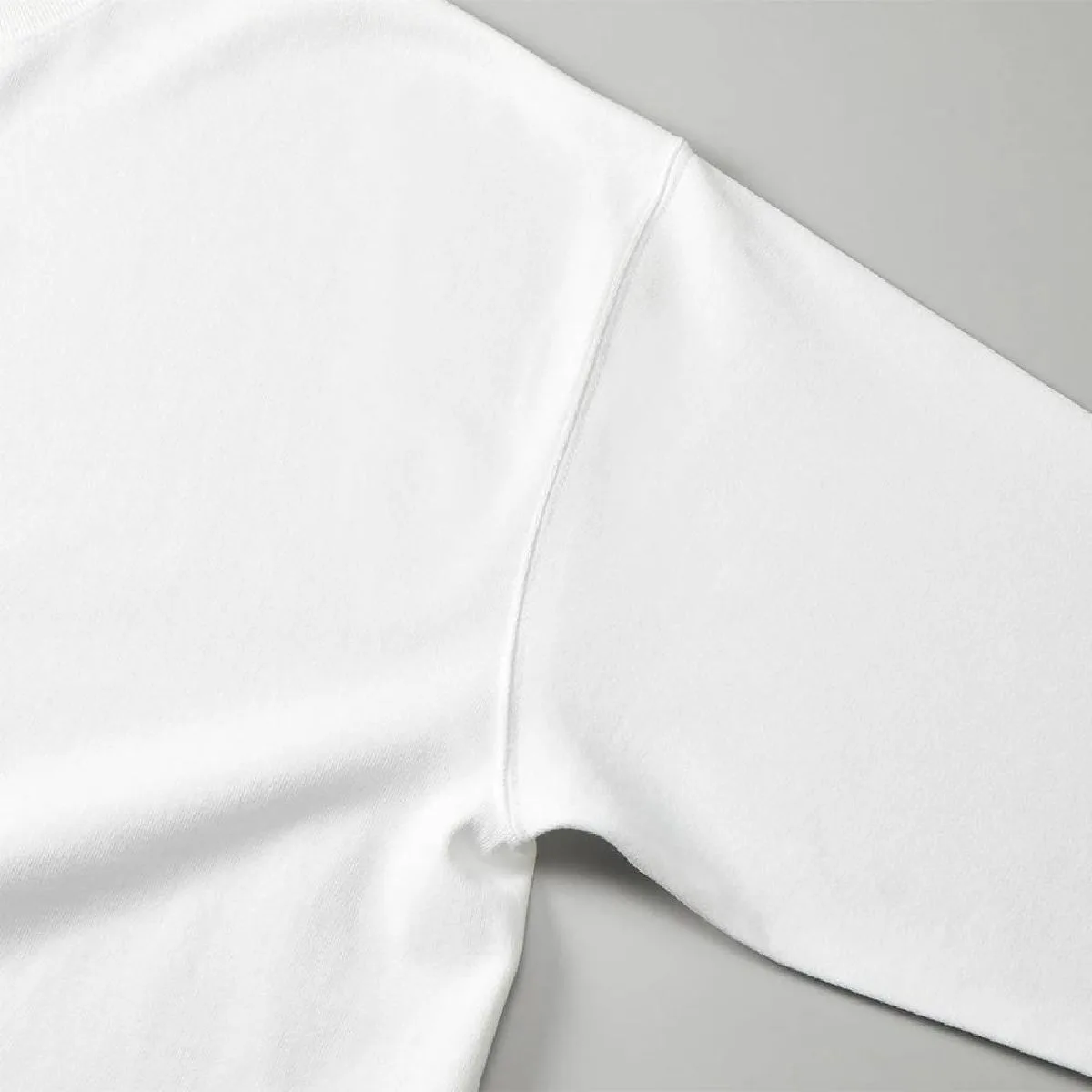 The armholes are finished with a sturdy double-needle stitch.