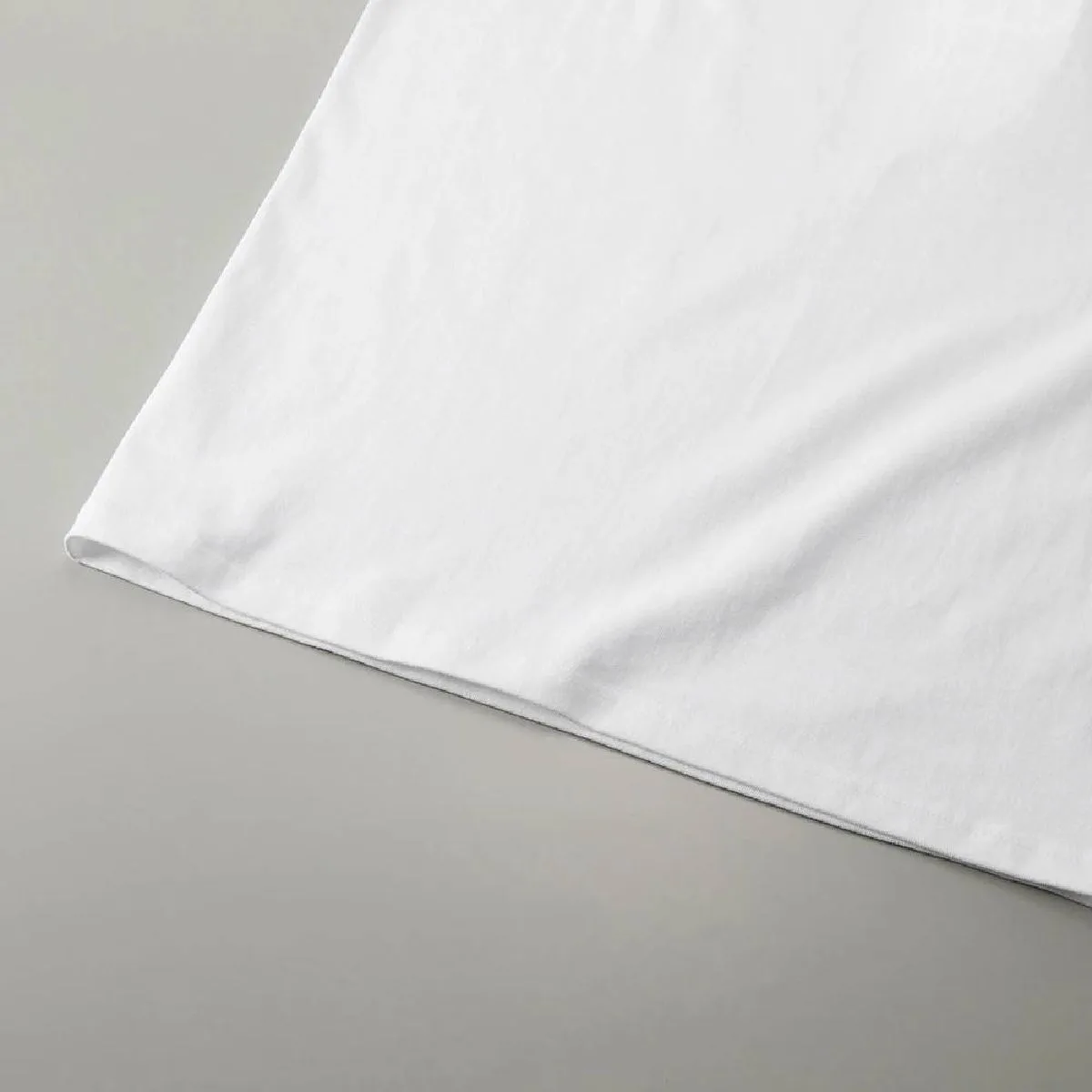 The hem is finished with a double needle stitch.