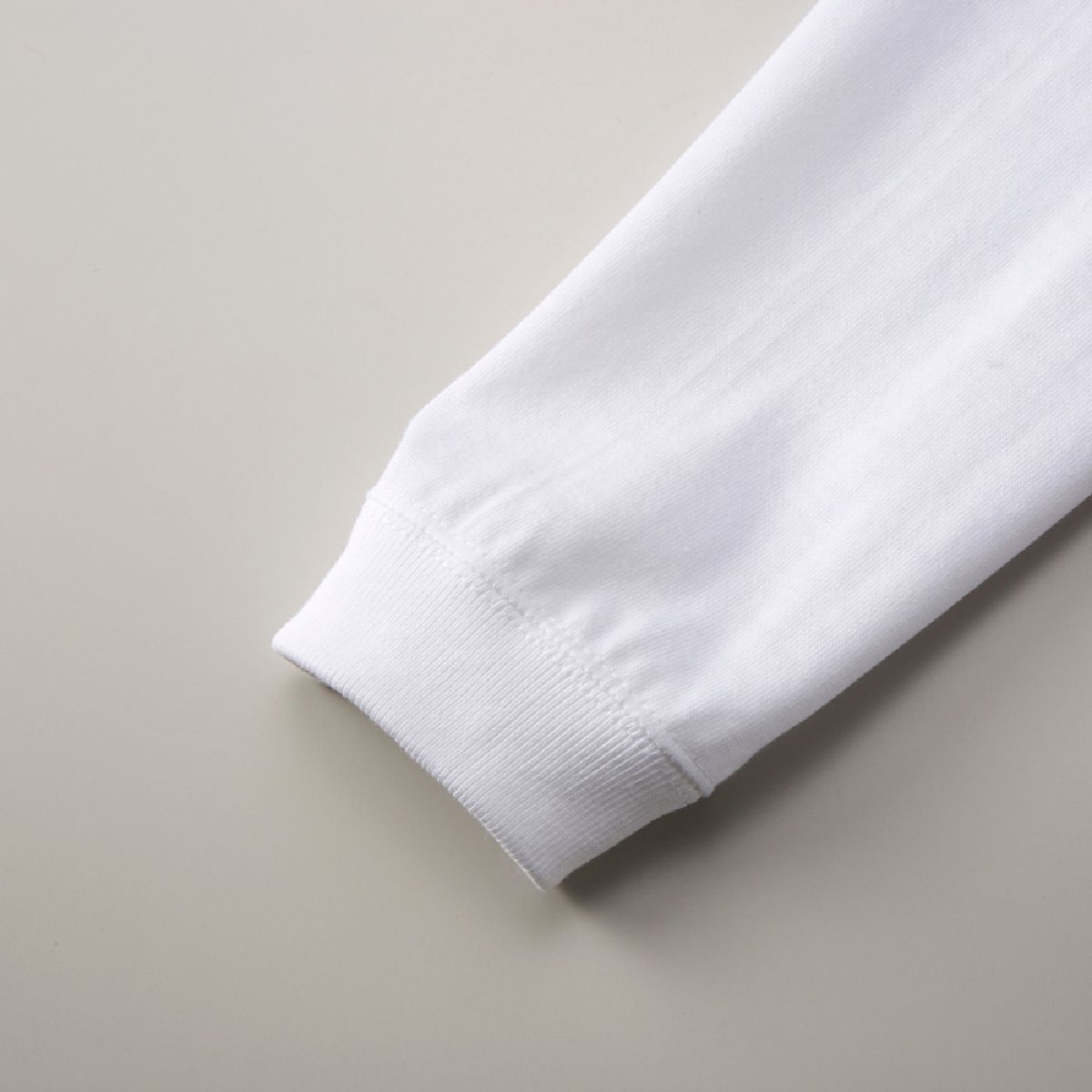 The cuffs have a 1.6-inch wide ribbed design, and the seams are finished with double-needle stitching.