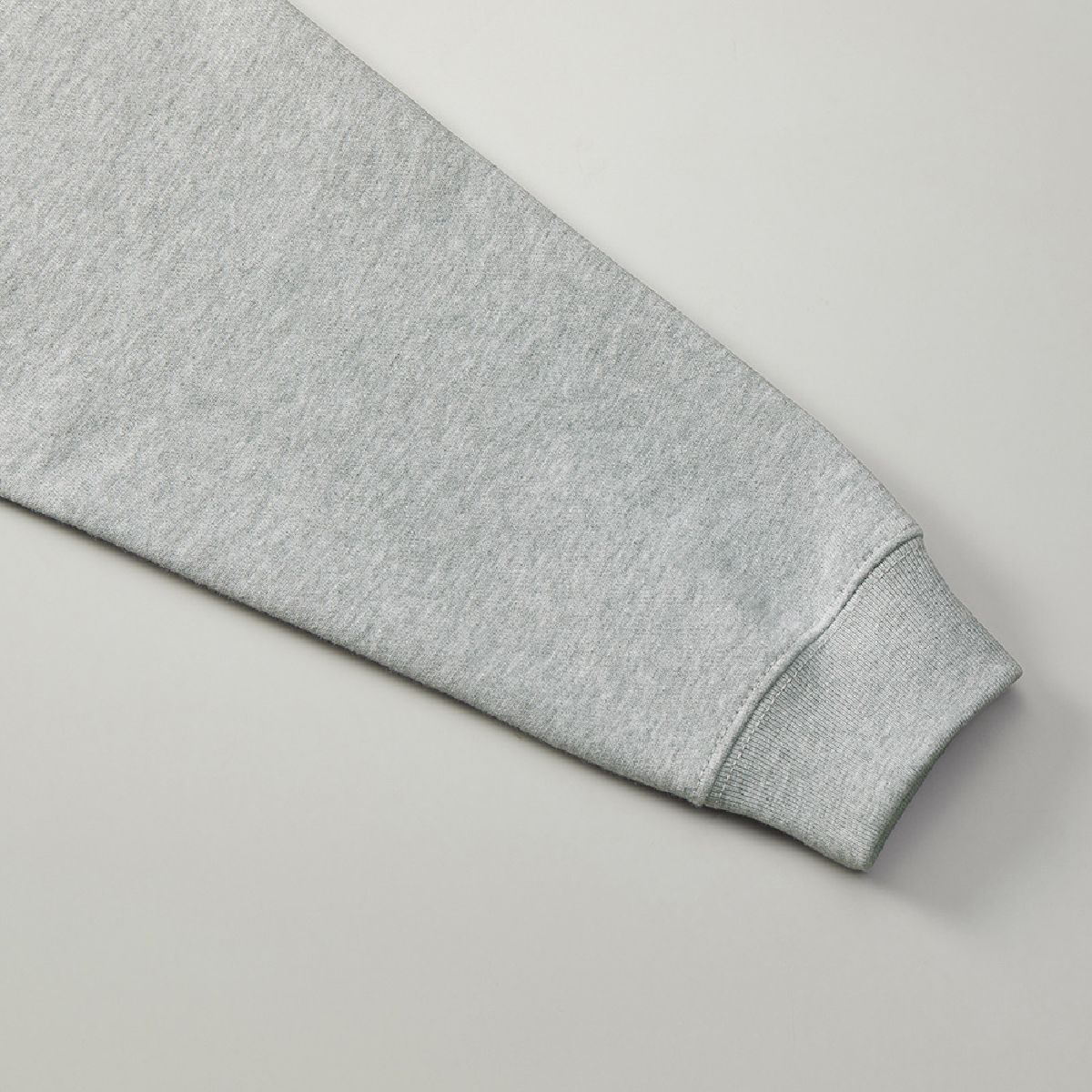 The cuffs are ribbed, and the seams are finished with double-needle stitching.