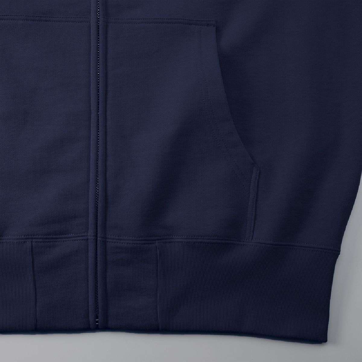 Features a kangaroo pocket and a front zipper with a design that conceals the zipper to protect the printed surface.