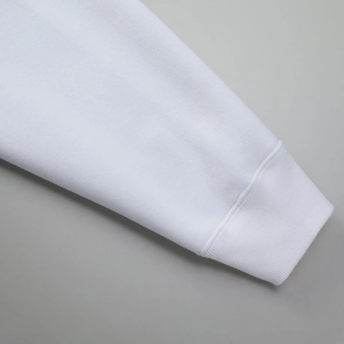 The seams between the cuff body and ribbing are finished with durable double stitching.