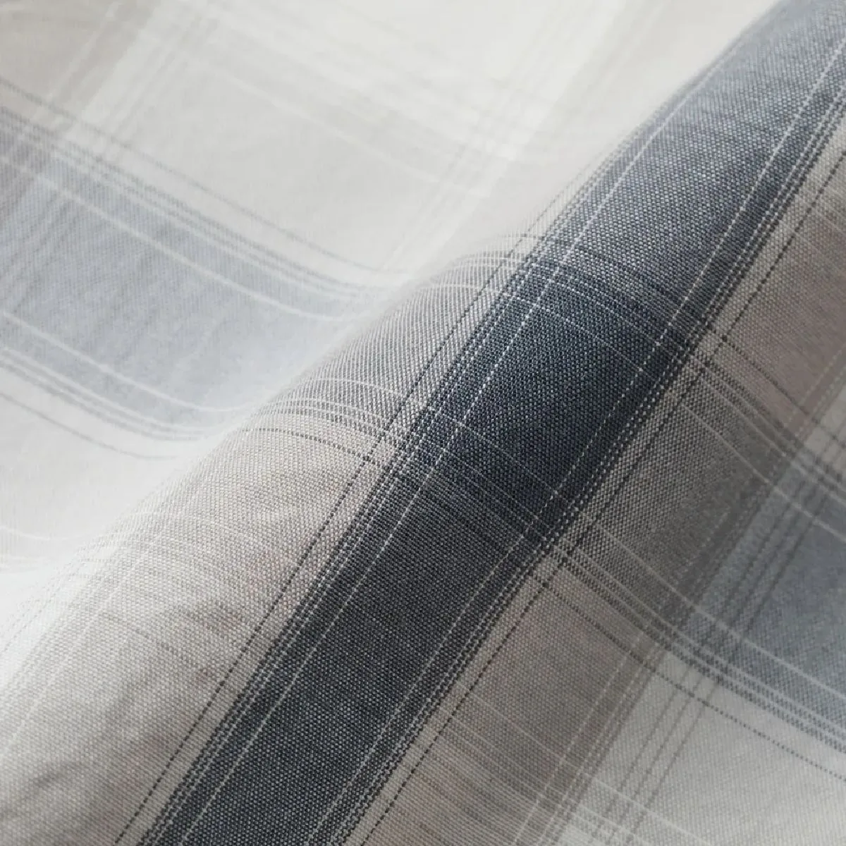 The garment washing process moderately reduces the stiffness and adds a soft texture to the fabric.