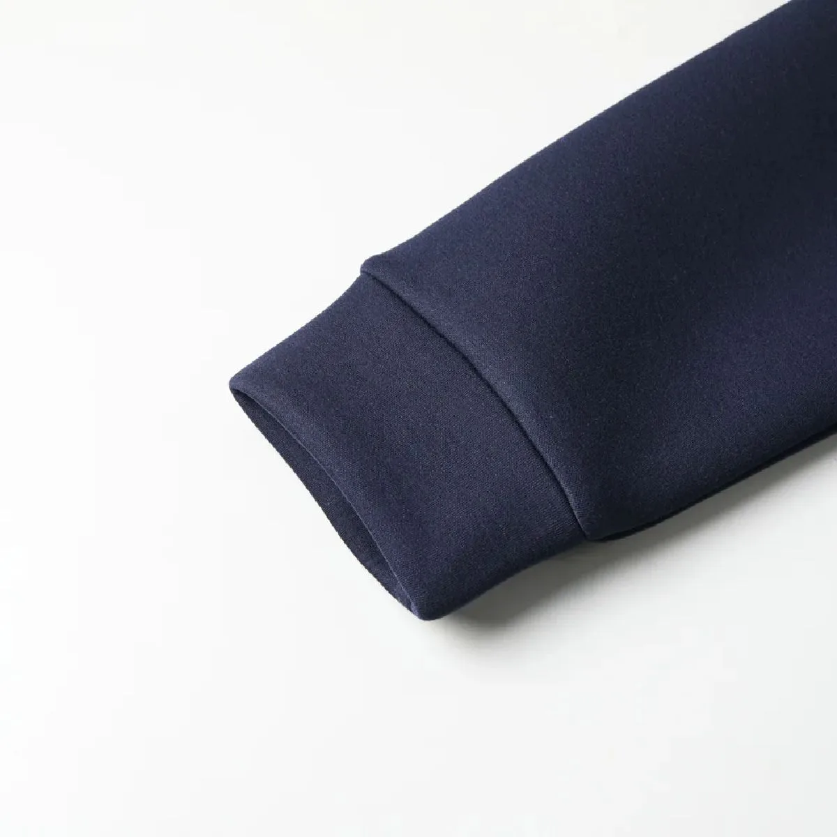 The cuffs are made from the same fabric as the body of the garment.
