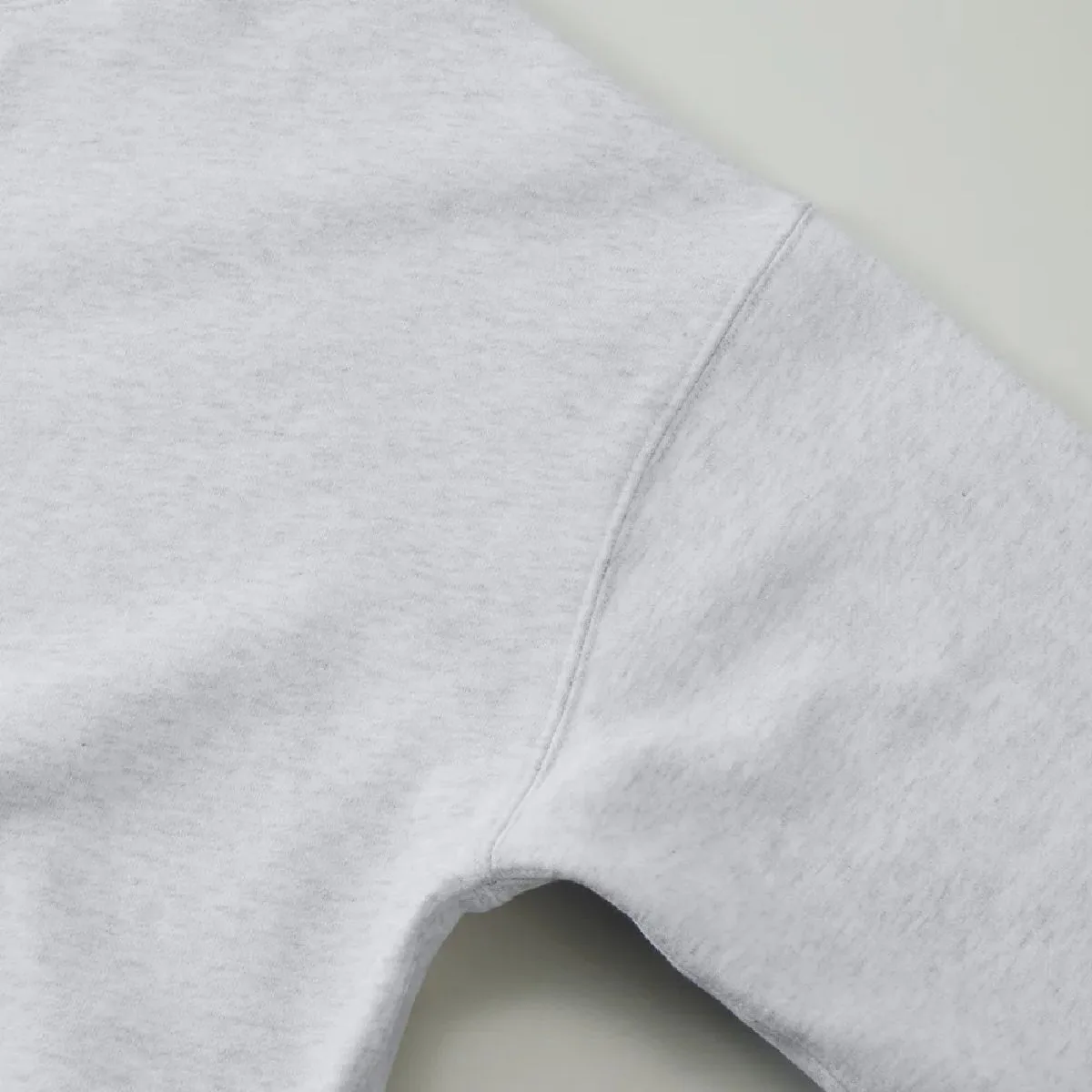 The armholes are finished with a sturdy double-needle stitching.
