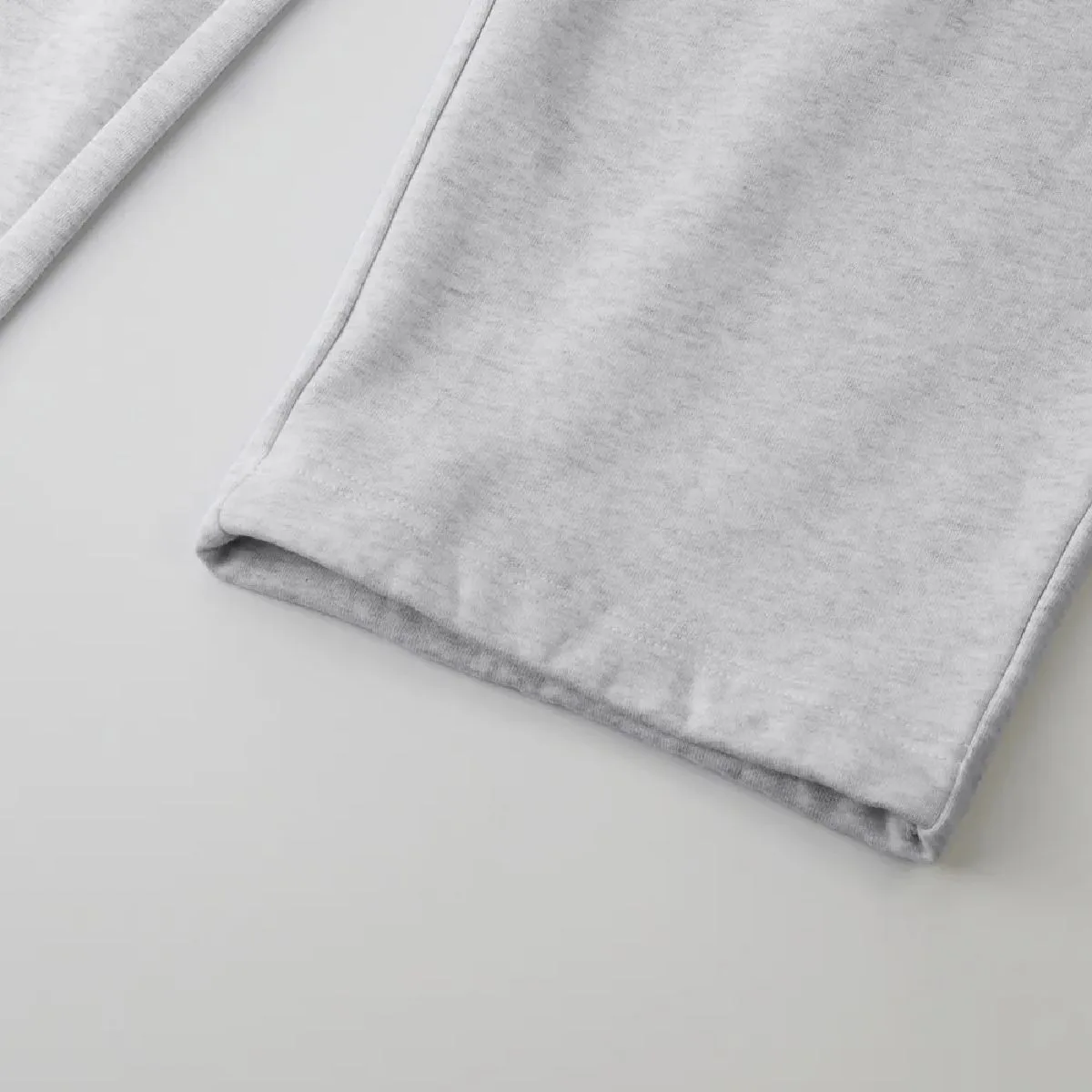 The hem is finished with a double needle stitch.