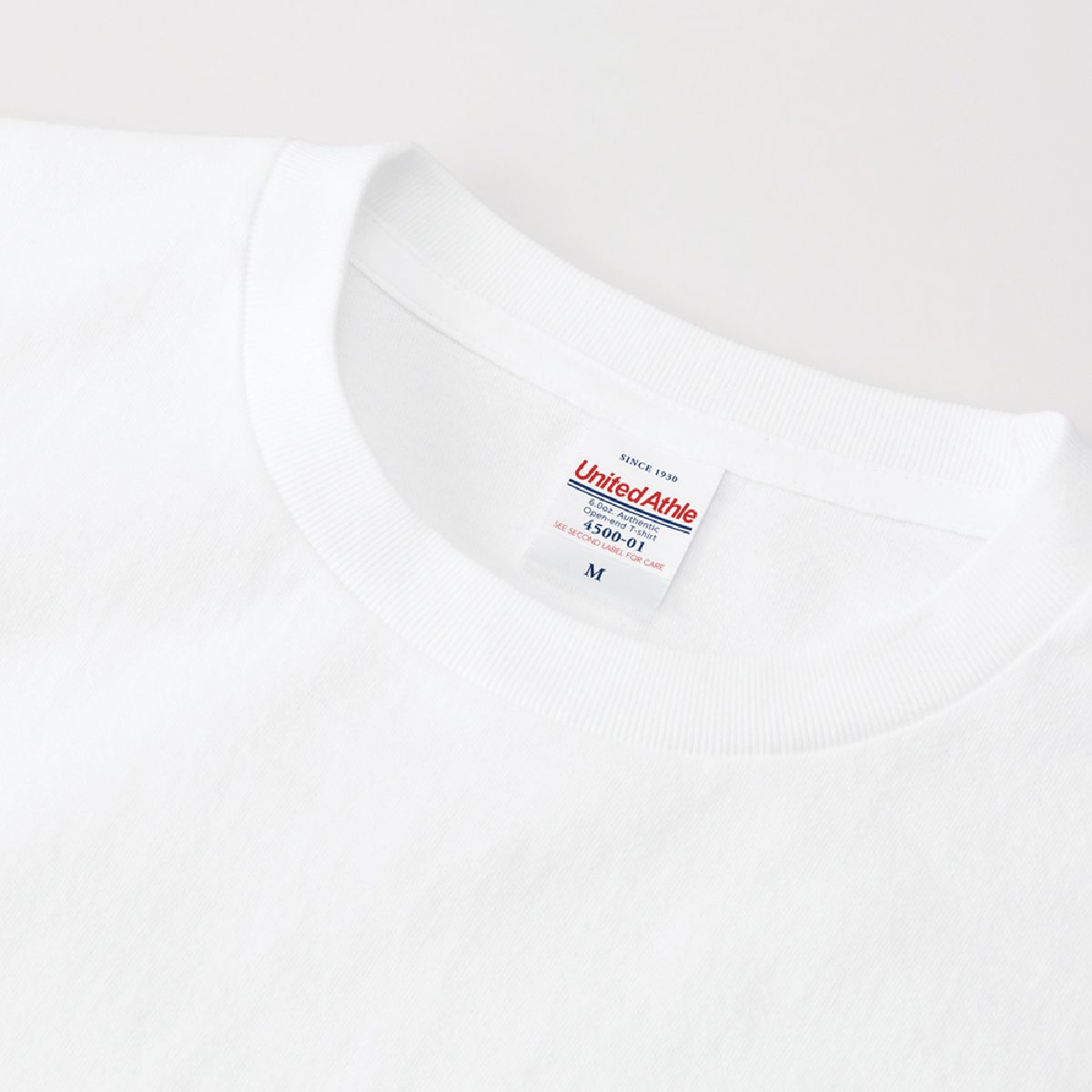 The neck ribbing features a minimalist, stitch-free design.