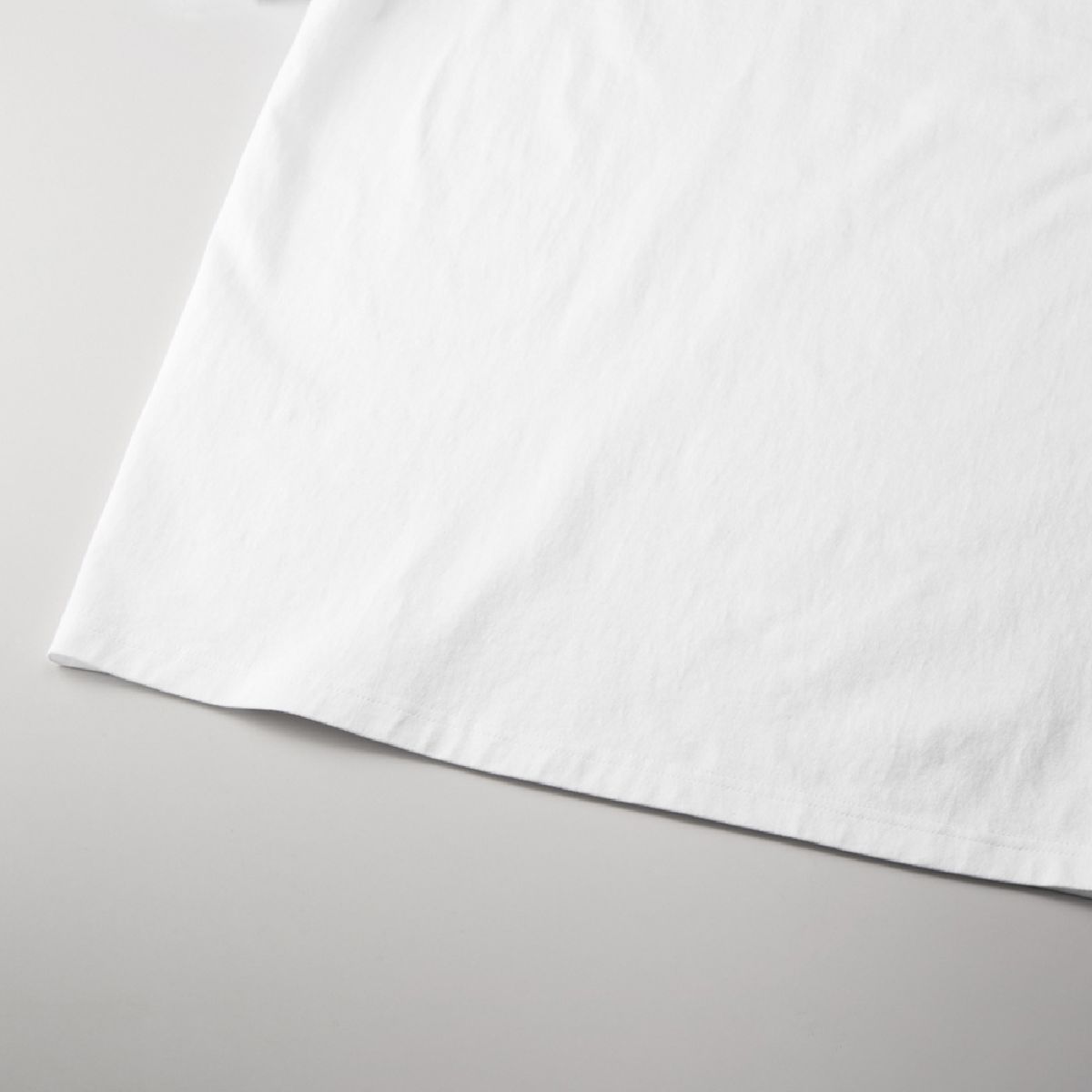 The hem is finished with a double needle stitch.