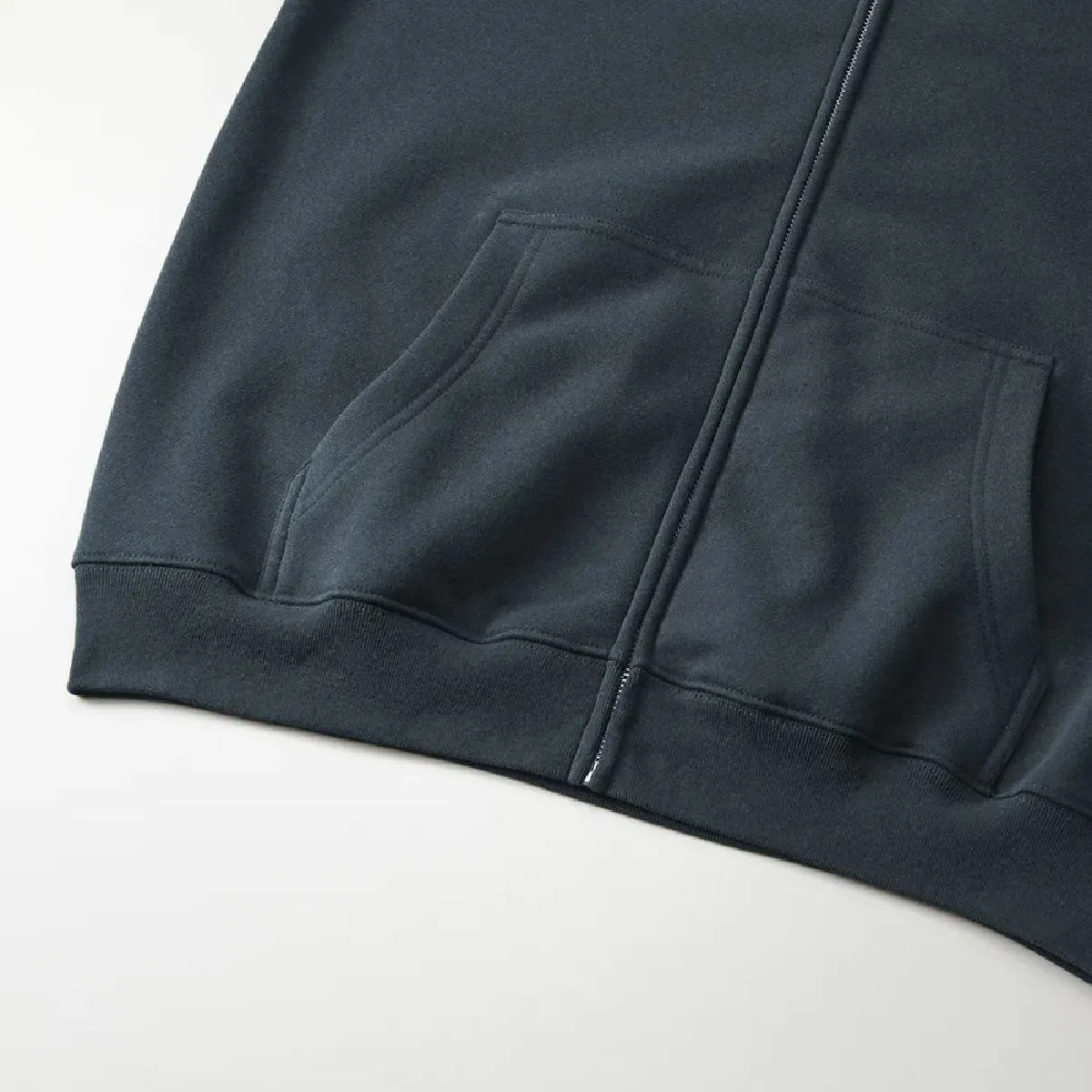 Large kangaroo pocket, ribbed hem and body seams finished with sturdy double-needle stitching.
