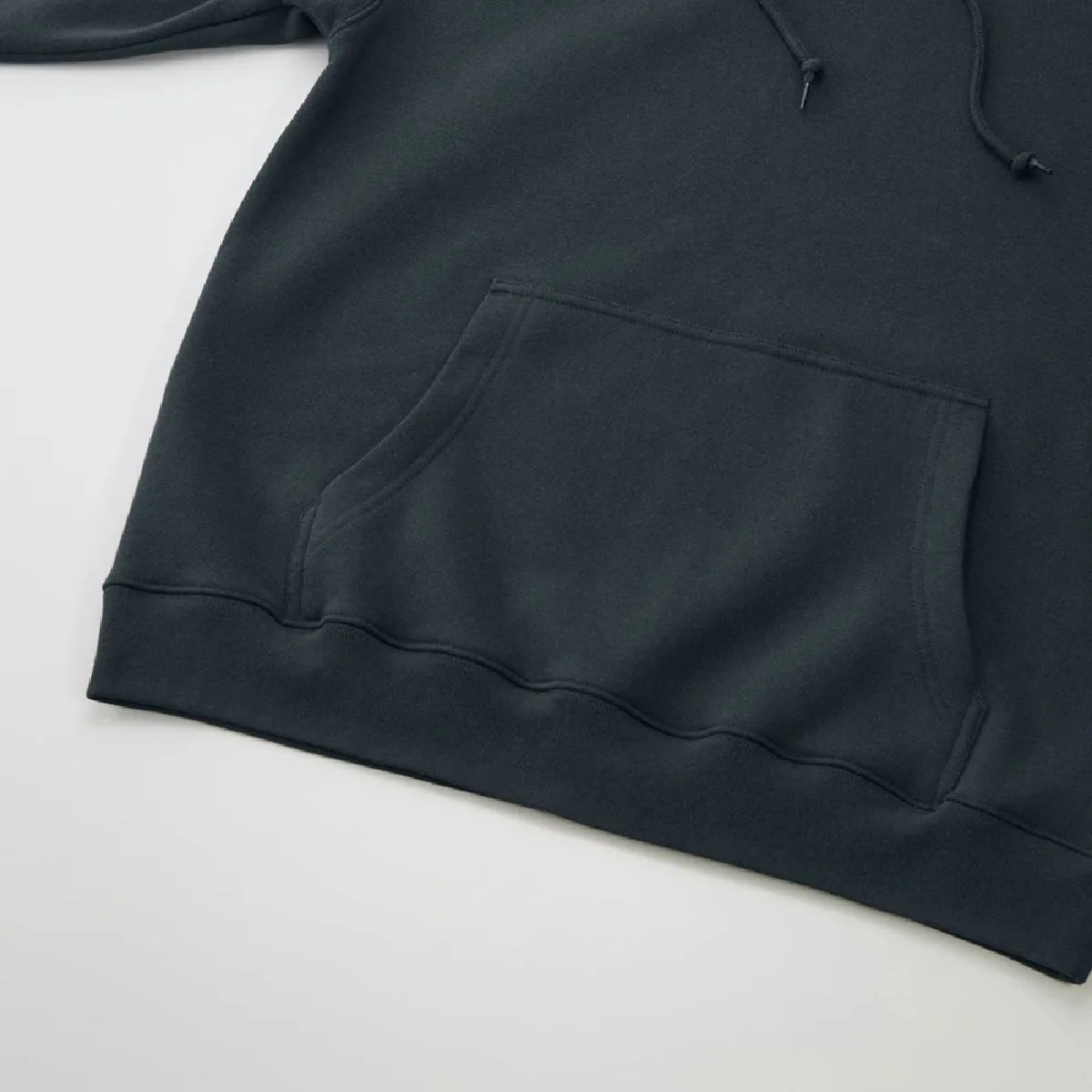 Large kangaroo pocket, ribbed hem and body seams finished with sturdy double-needle stitching.