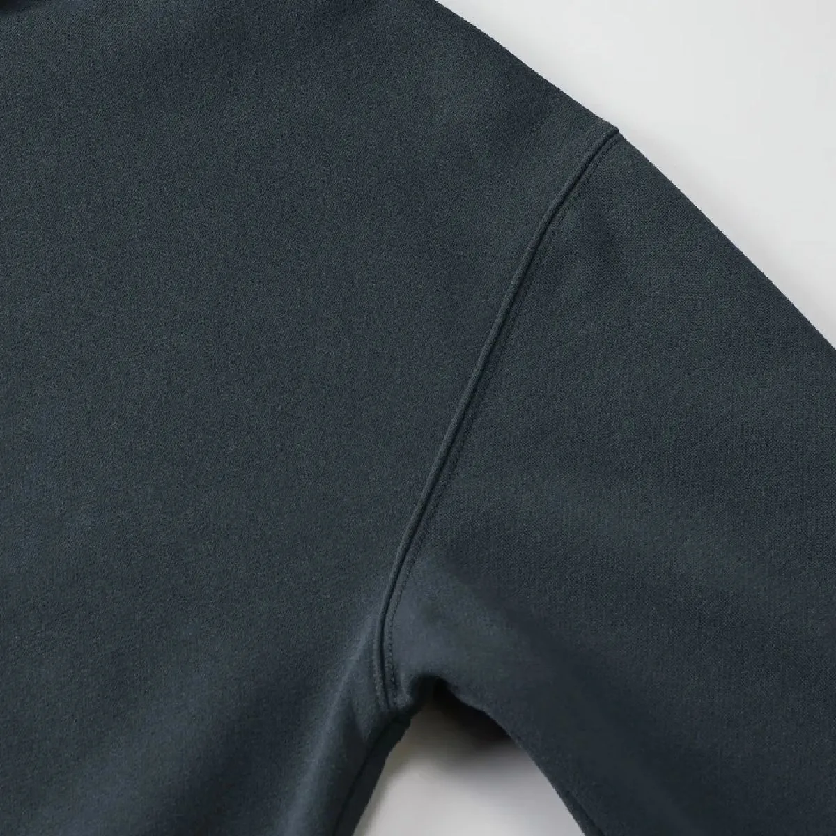 The armholes are finished with a sturdy double-needle stitching.