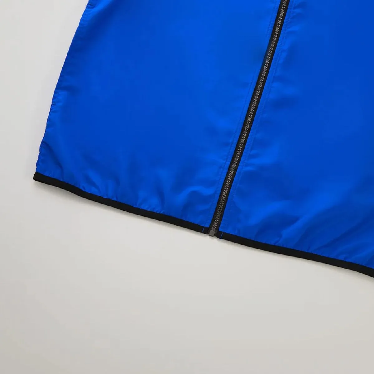 The hem is piped with stretch tape for a comfortable, body-hugging fit.