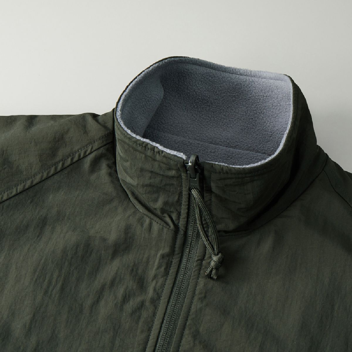 The collar is a stand collar, designed to keep your neck warm.