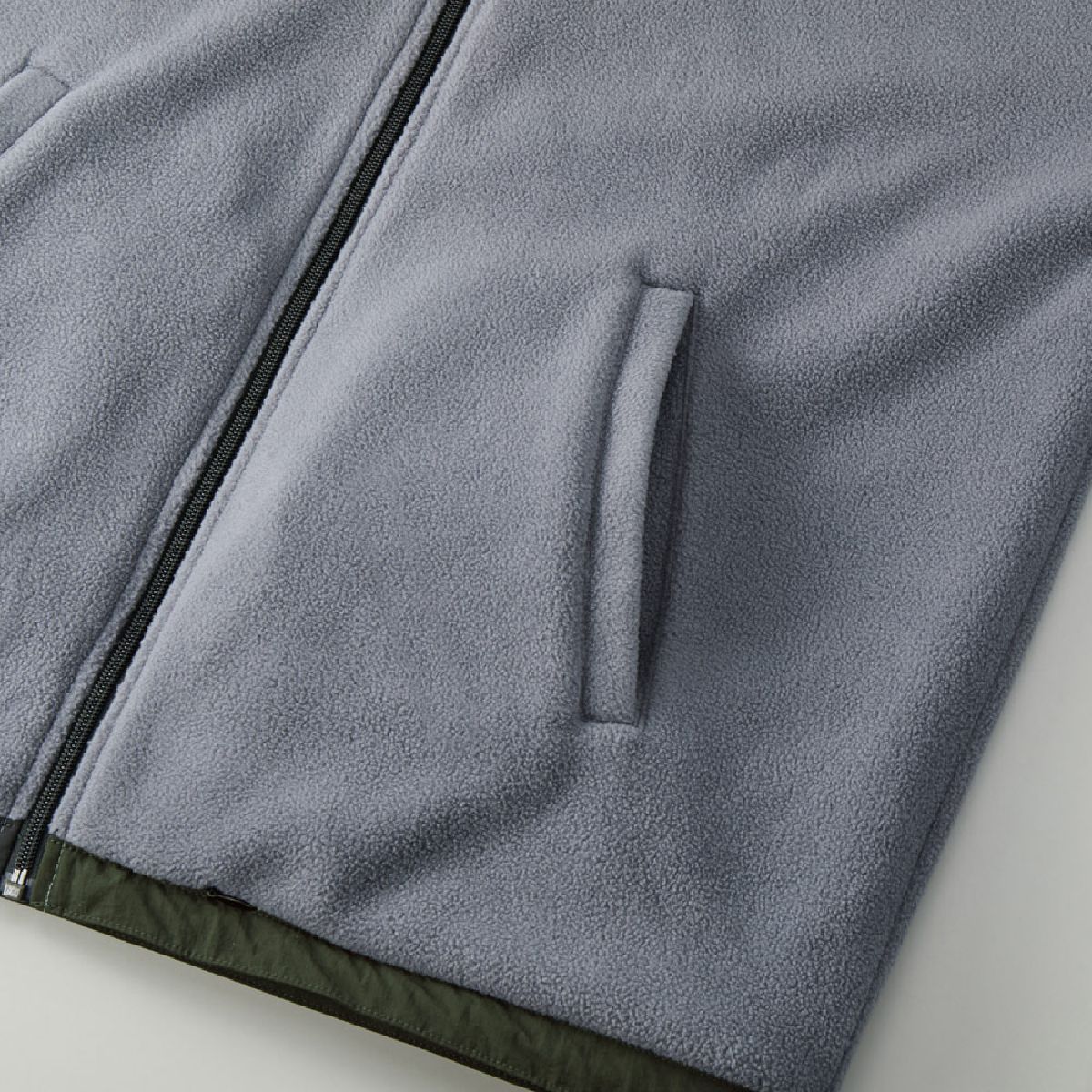 Features a single-welt pocket on the side (fleece side).