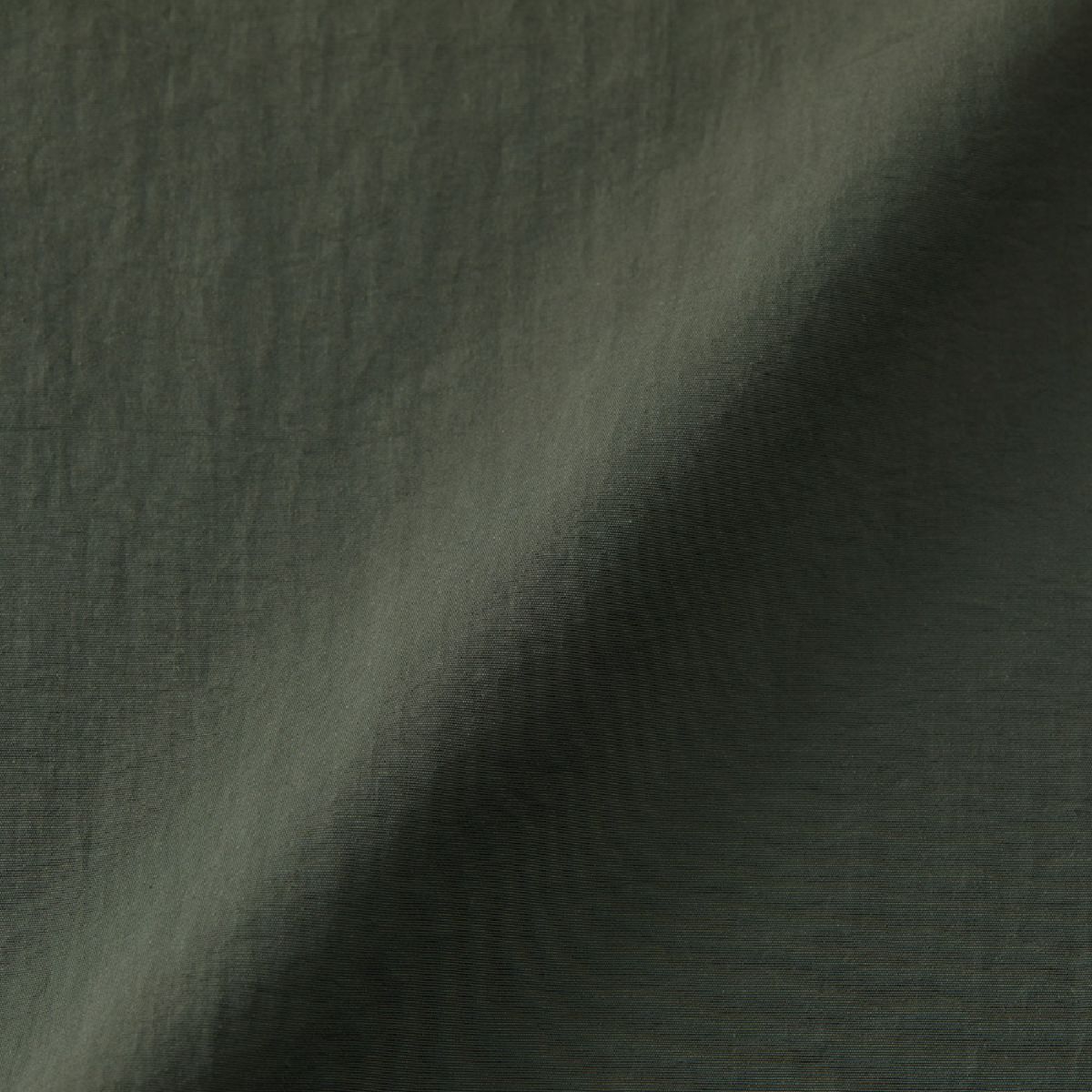 A fabric that feels like cotton despite being 100% nylon (nylon side).